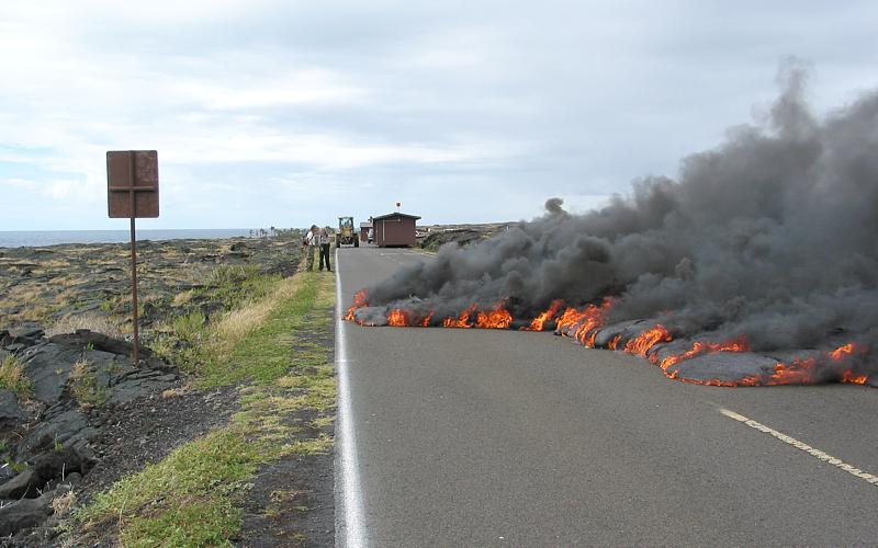 Lava flowing over asphalt