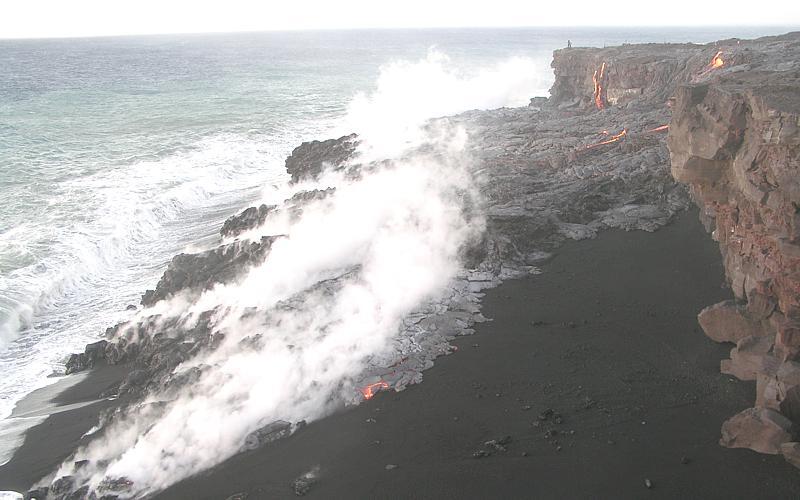 Lava flow sneaking eastward across black sand beach