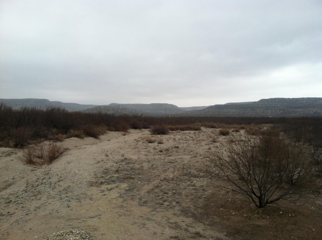 Live Oak Draw at Hwy 290, TX; stream disappears above Hwy 290 and reappears.