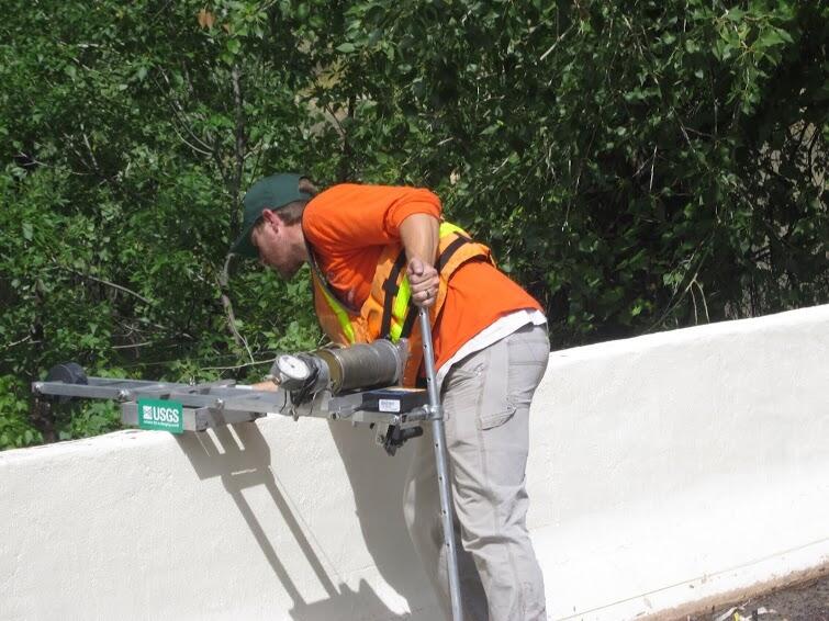 Image: USGS Scientist Taking Measurements Along Bear Creek