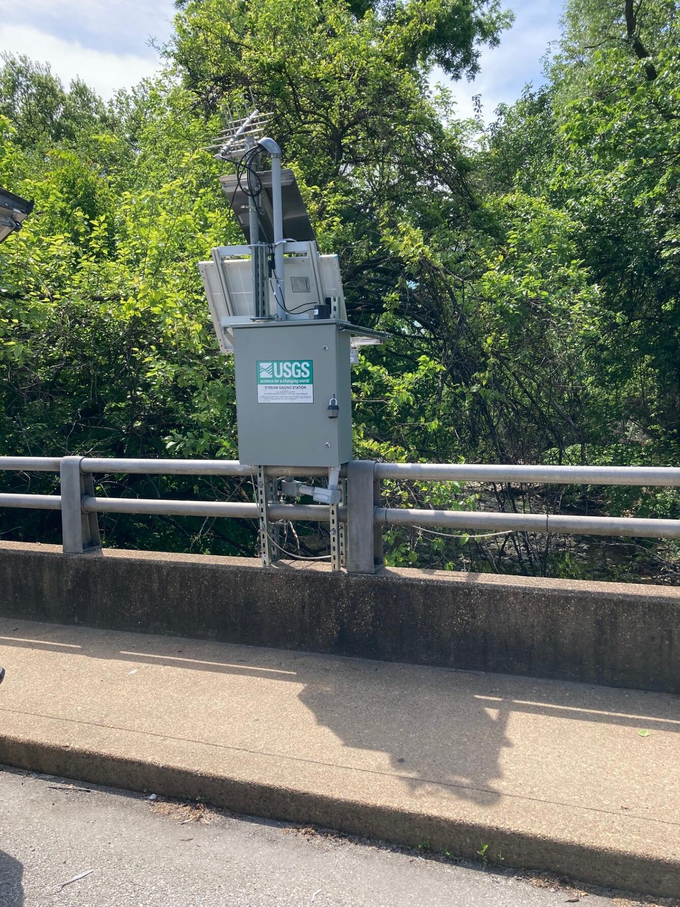 A streamgage on a bridge.