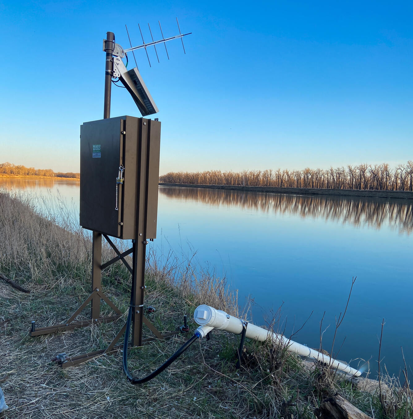 Streamgage with water-quality sonde at USGS gage 06174500 looking towards the Milk River at Nashua, Montana