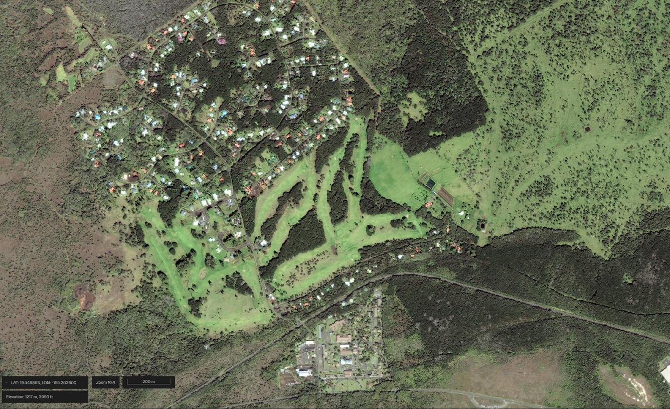 Color satellite image of developed area near summit of volcano