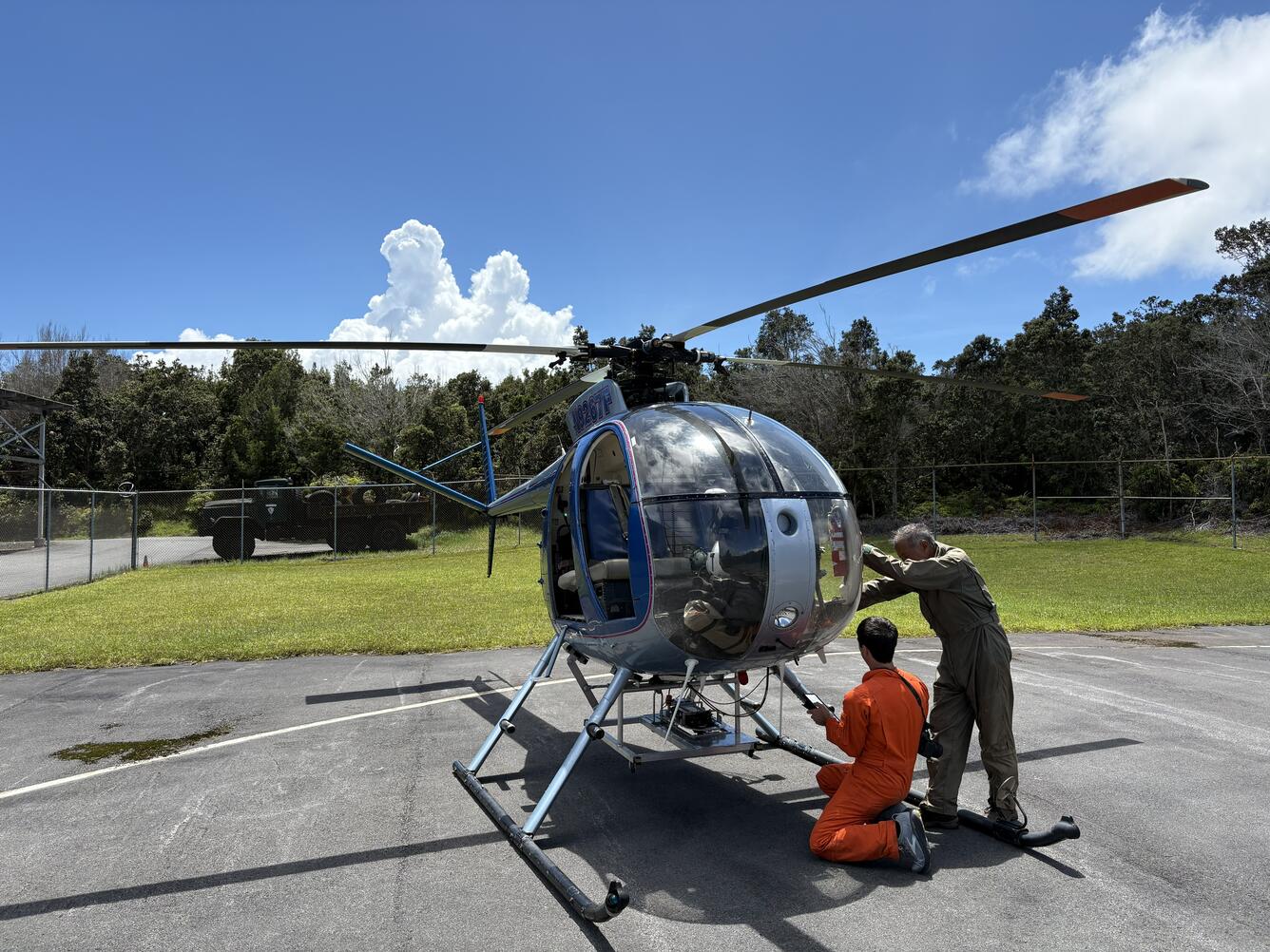 Color photograph of helicopter being prepared for flight
