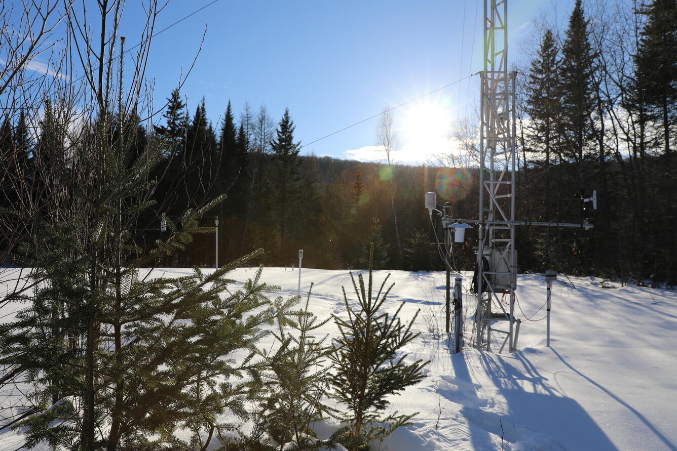 Snow monitoring equipment in a snowy field.