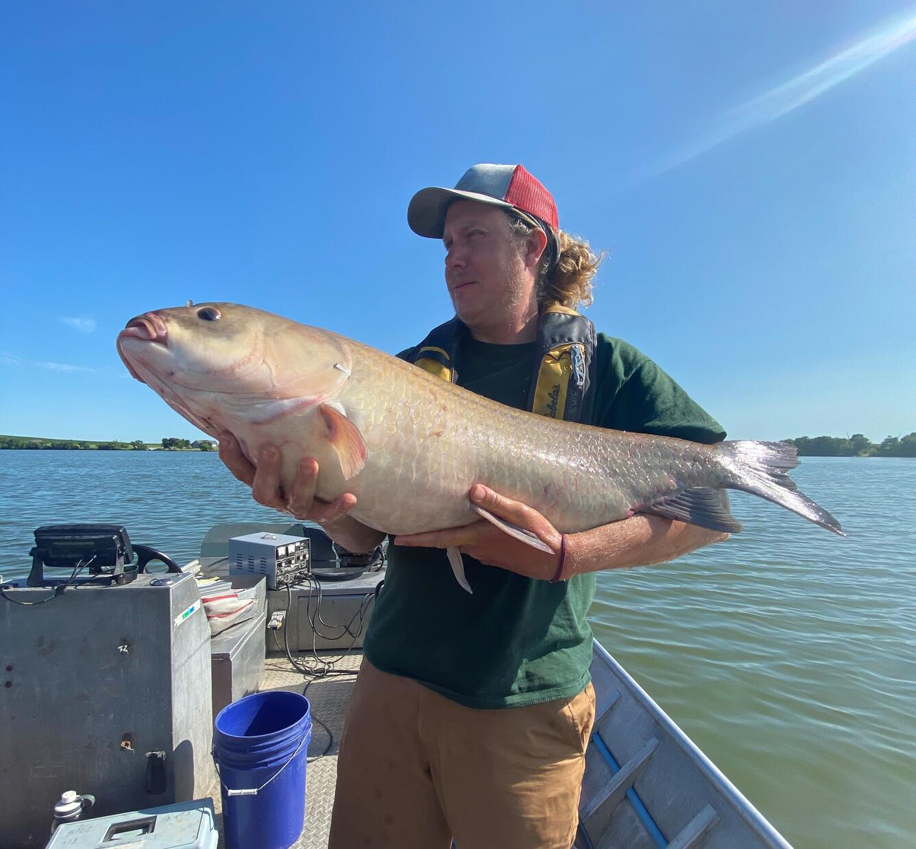 Martin Simonson holding a bigmouth buffalo