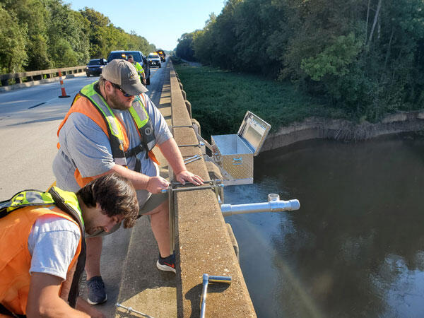 Kyle Anderson and Graham Murray install camera on I-95 bridge over the Pee Dee River, South Carolina.