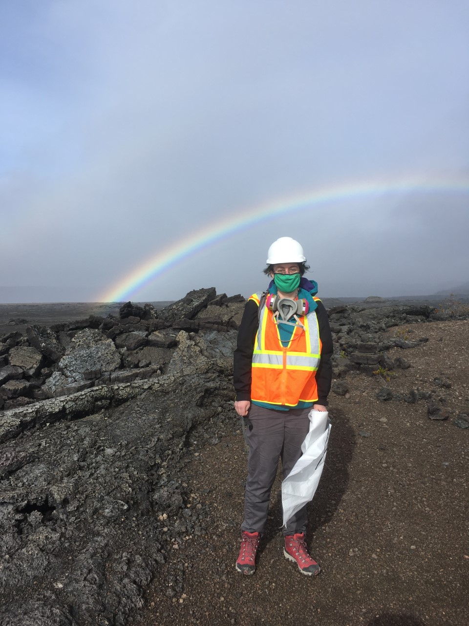 Color photograph of scientist deploying instrument in the field