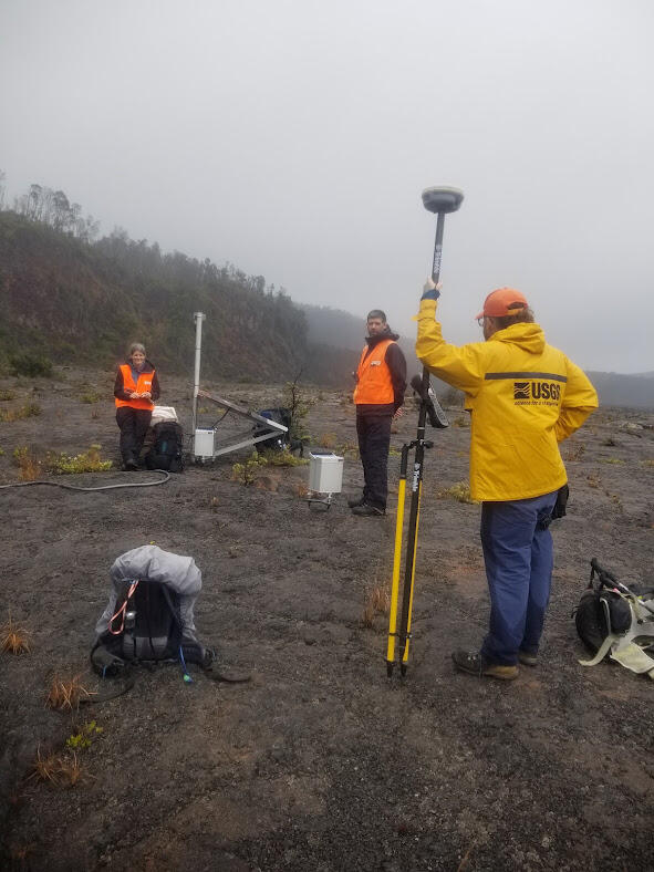 Color photograph of scientists in field