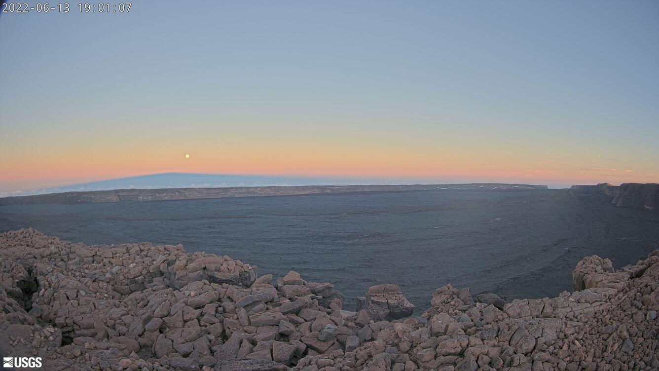 Color photograph of sunset from volcano summit