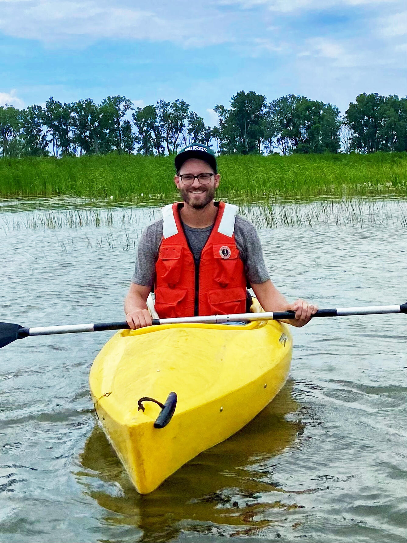 Wesley Bickford in a canoe on Metzger Marsh