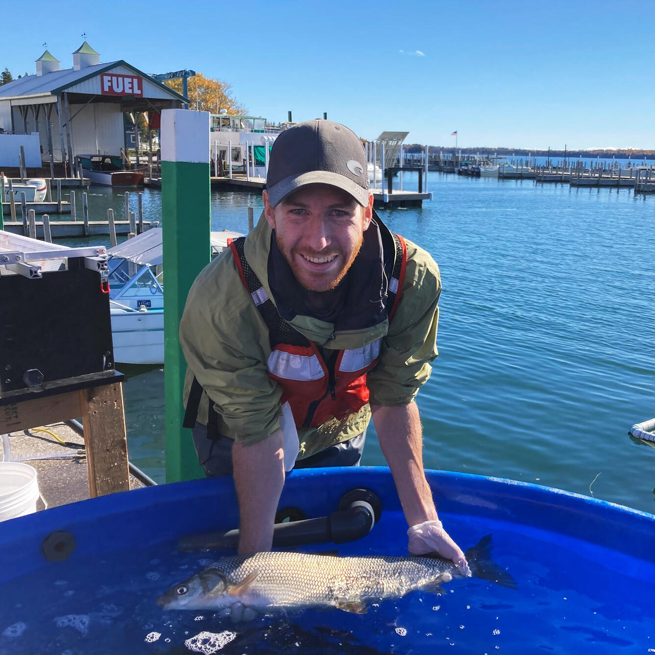 Tyler Funnell holding a whitefish