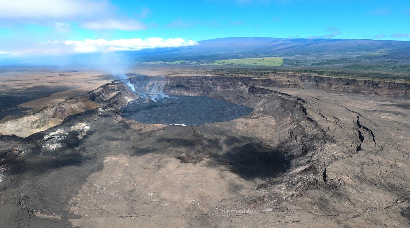 Color photograph of crater eruption