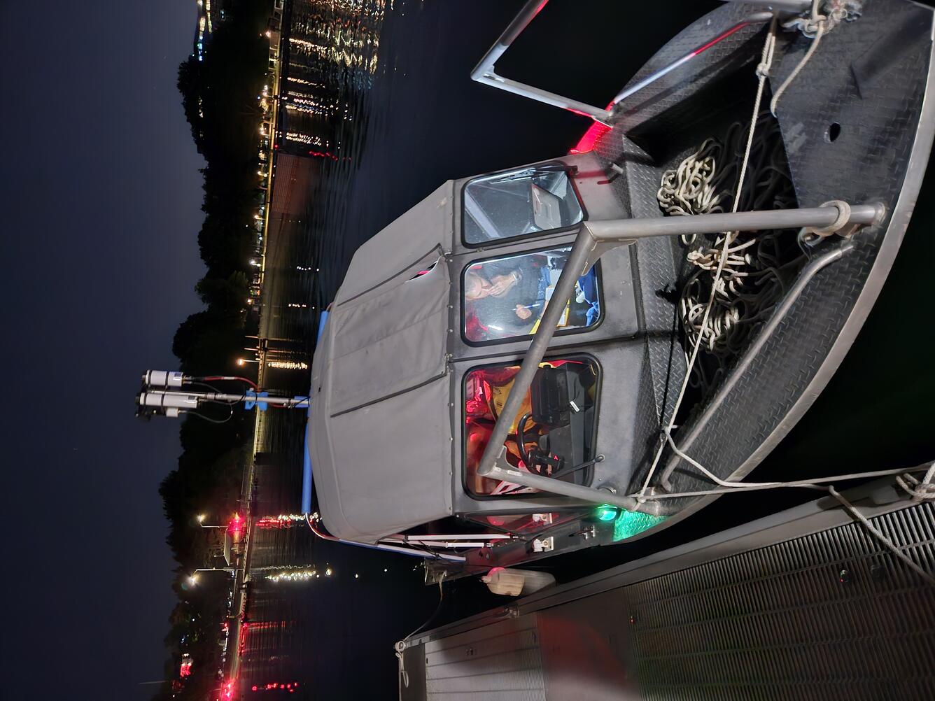 Boat strung to dock in the night in Seattle, WA