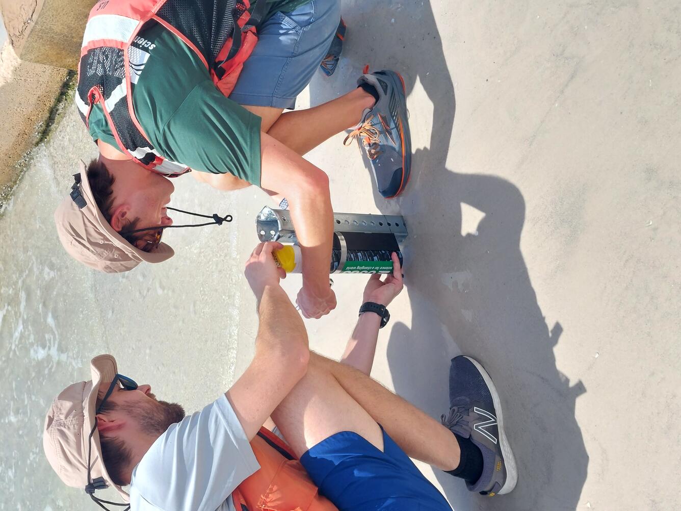 Researchers attaching instrument