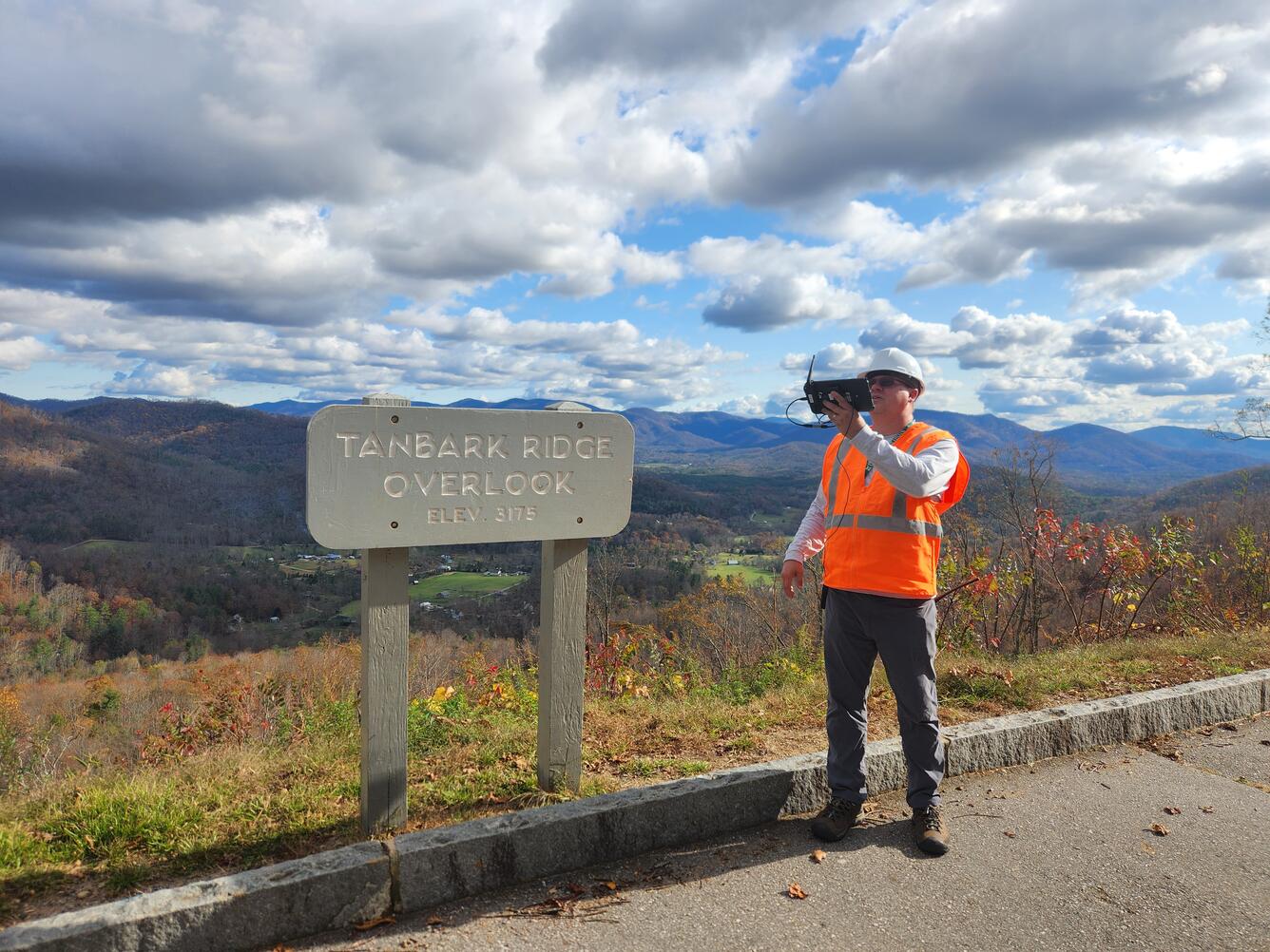 Operator piloting a drone at the Tanbark Ridge Overlook along the Blue Ridge Parkway in North Carolina