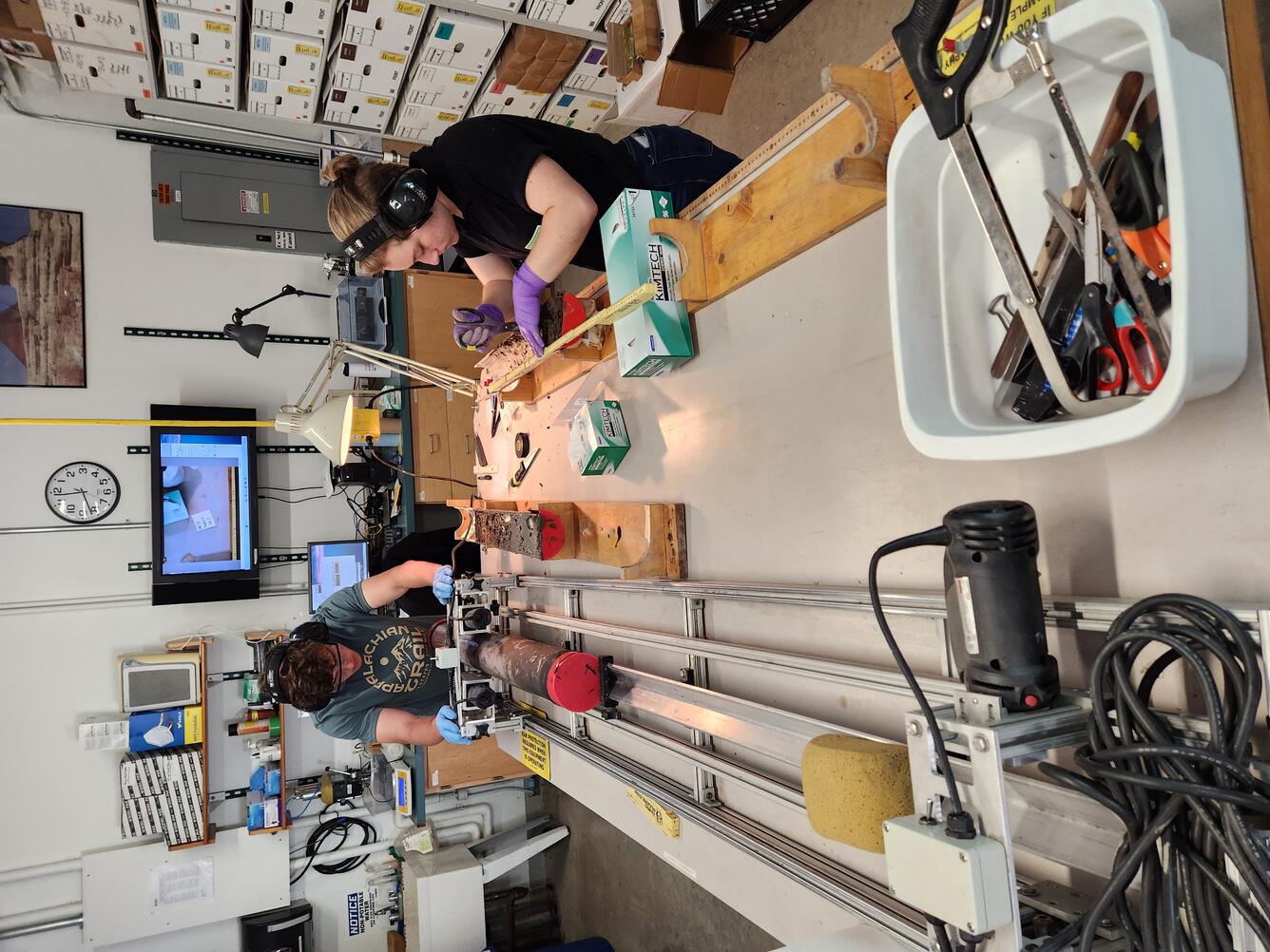 Interns working with sediment cores in a laboratory