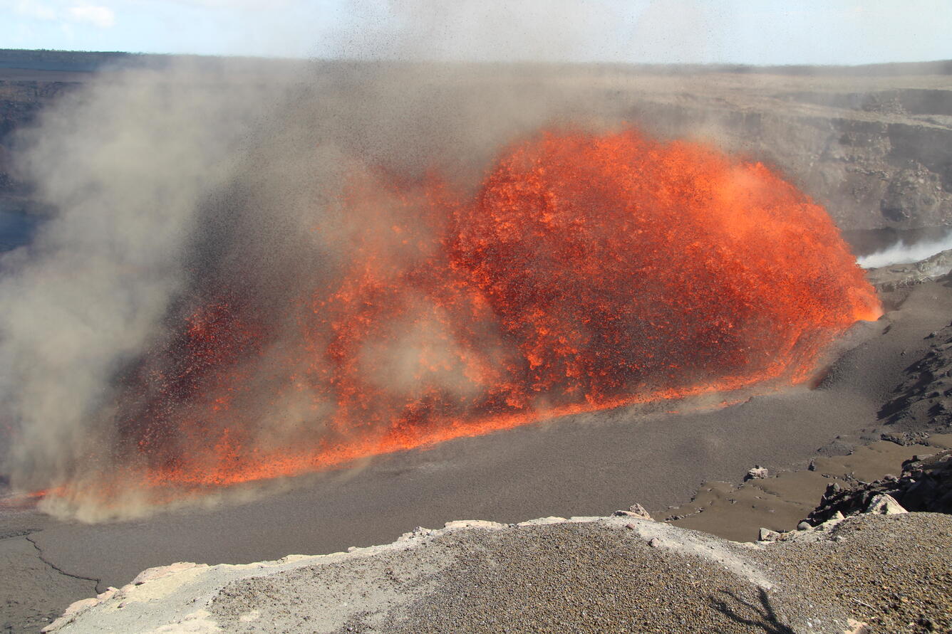 Colro photograph of lava erupting at an angle