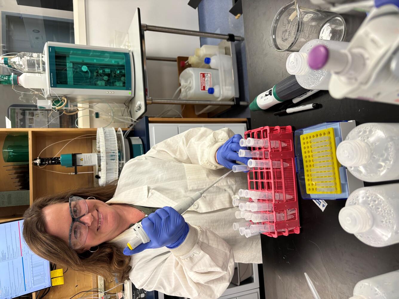 Scientist using a pipette in a lab