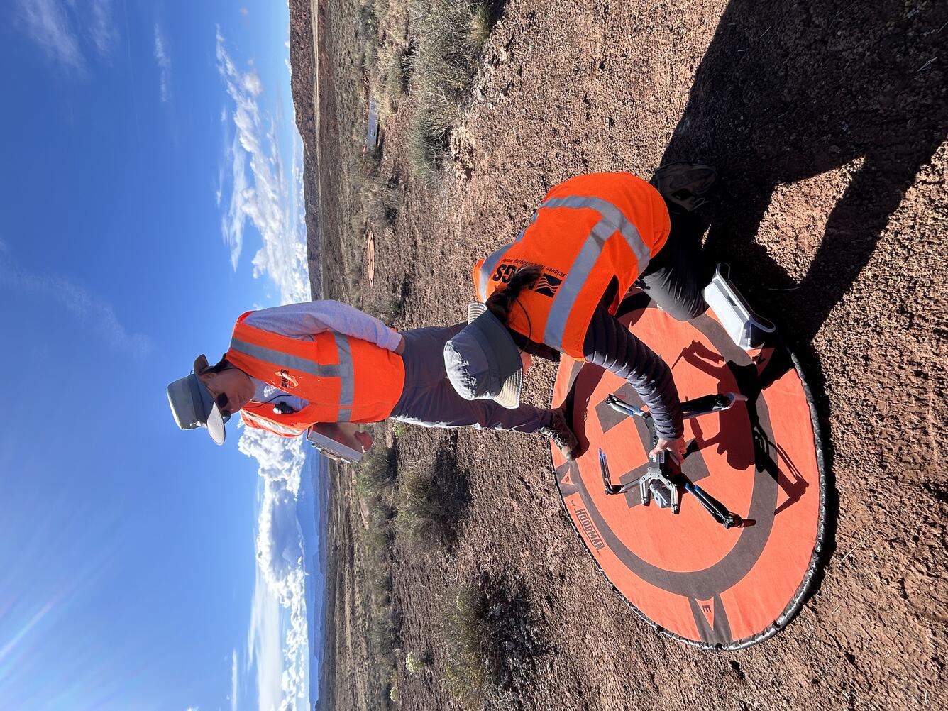 Two drone pilots set up equipment to be used in study near Moab, Utah