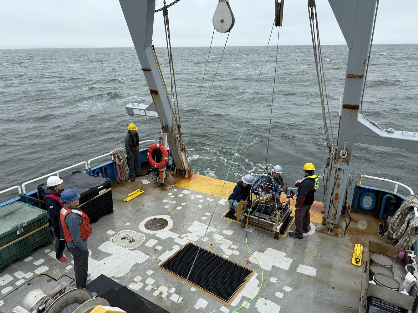 People working on a ship at sea