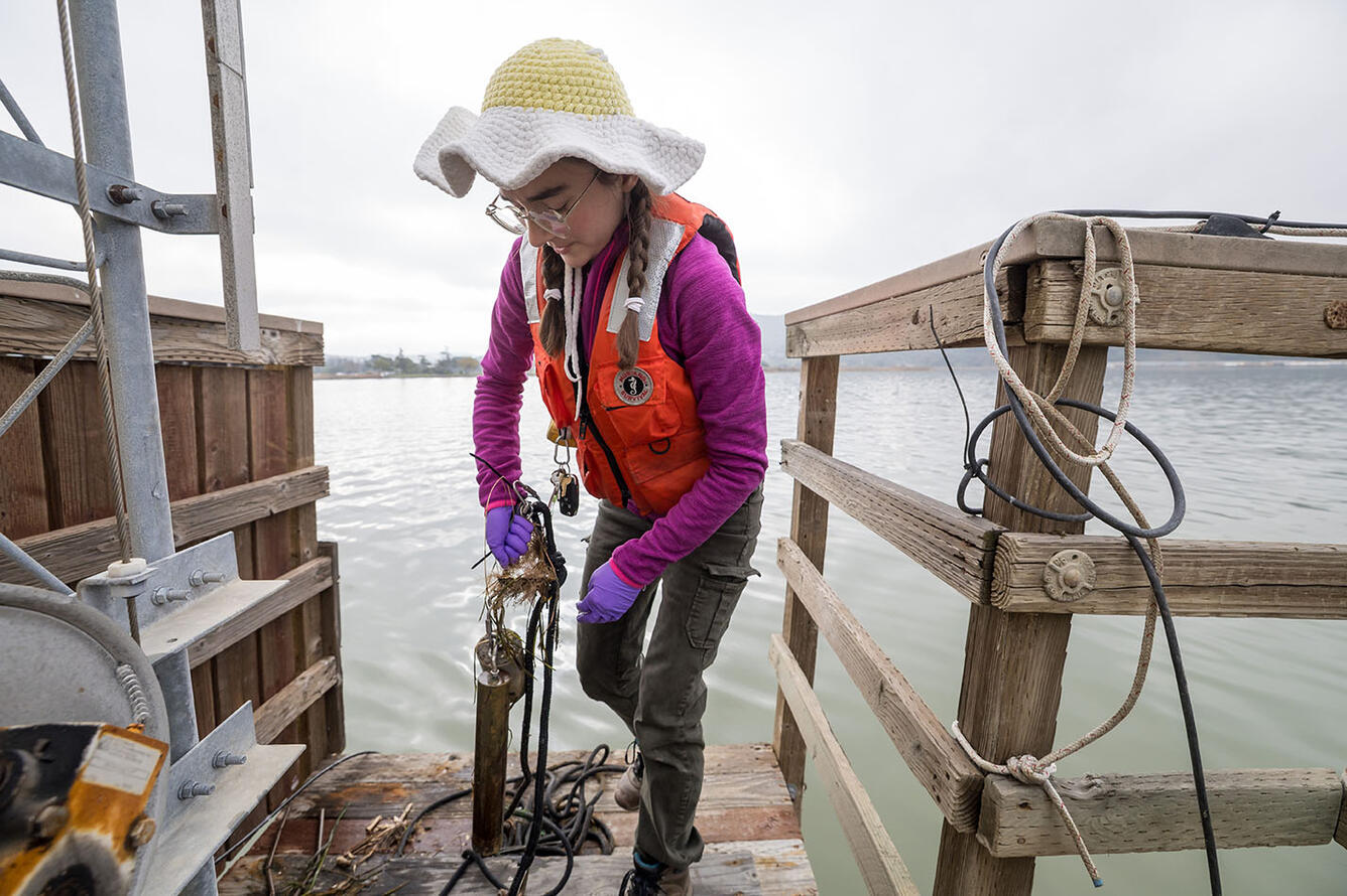 Scientist packs up gear used to gather shellfish samples