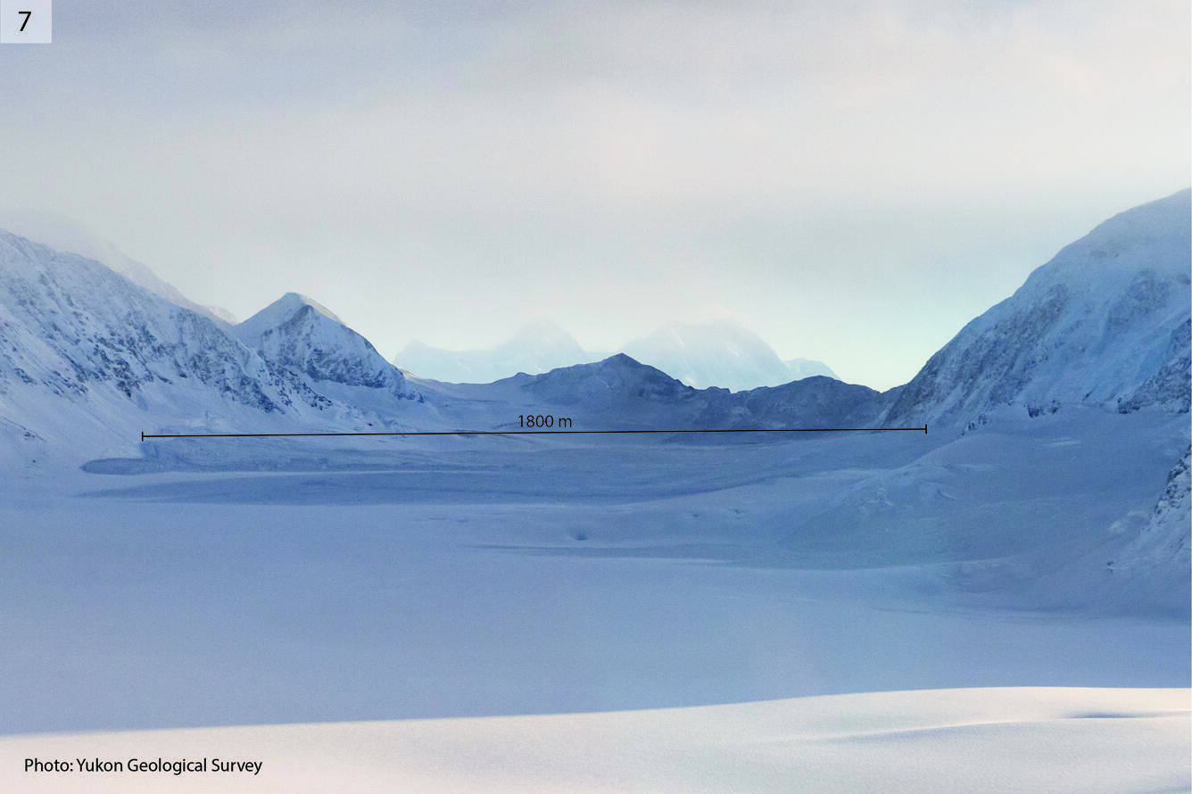 Snowy mountain and valley with label showing the size of the debris lobe as 1800m long