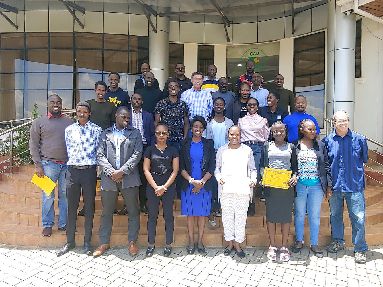 Trainees displaying their completion certificates from Capacity Building classes at ICPAC, Ngong Town, Kenya