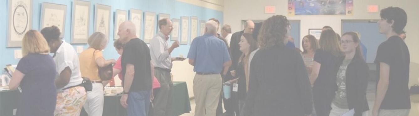 Visitors looking at the Antarctic Cachet Collection Art Hallway Exhibit.