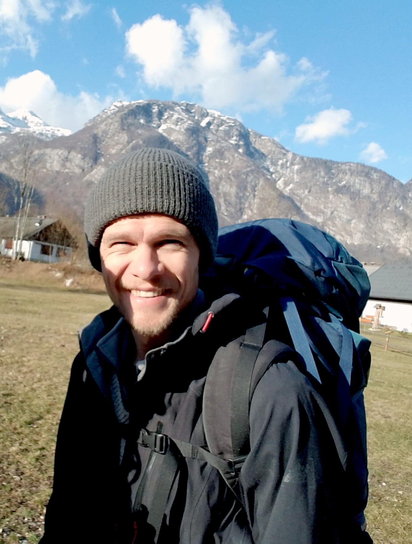 Person standing in front of a mountain