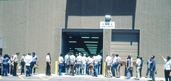 group of people waiting at entrance to building