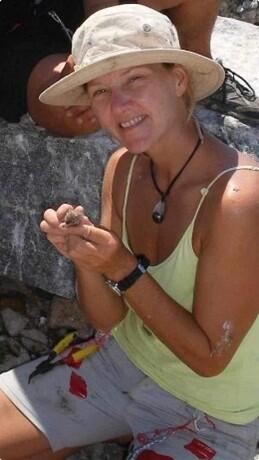 Woman holding a tern in a hat