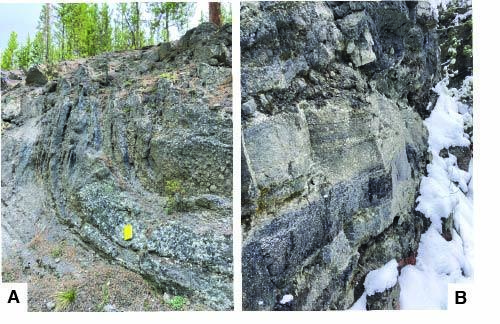 Rock outcrops that show banding in the interior of rhyolite lava flows