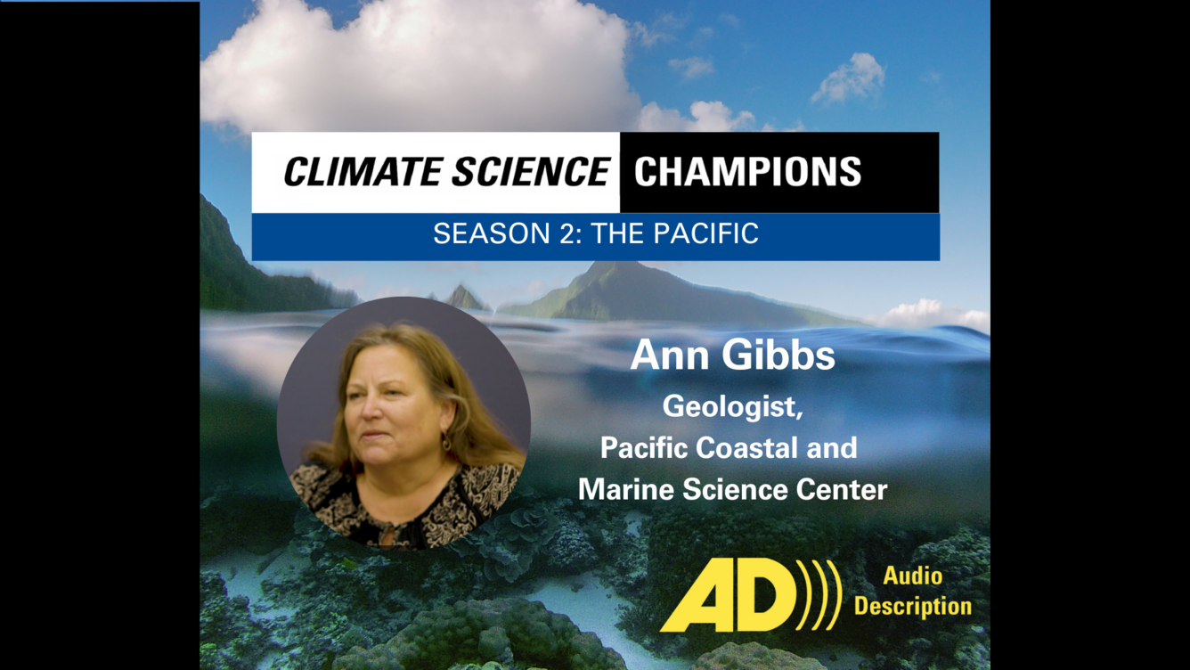 Background of coral reefs beneath waves. Overlaid with photo of white woman with light brown hair. Audio description icon in