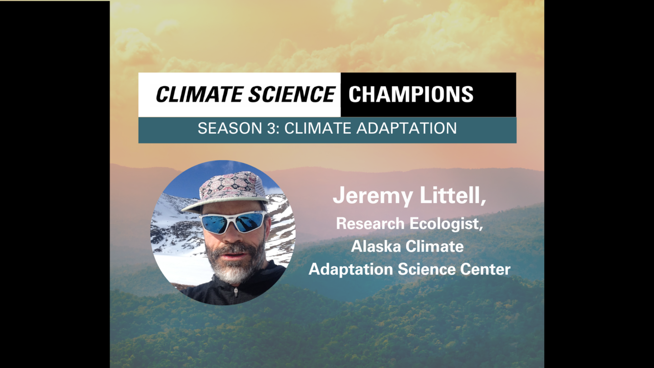 Misty mountains, overlaid with a selfie of a white, bearded man wearing sunglasses standing in front of a glacier.