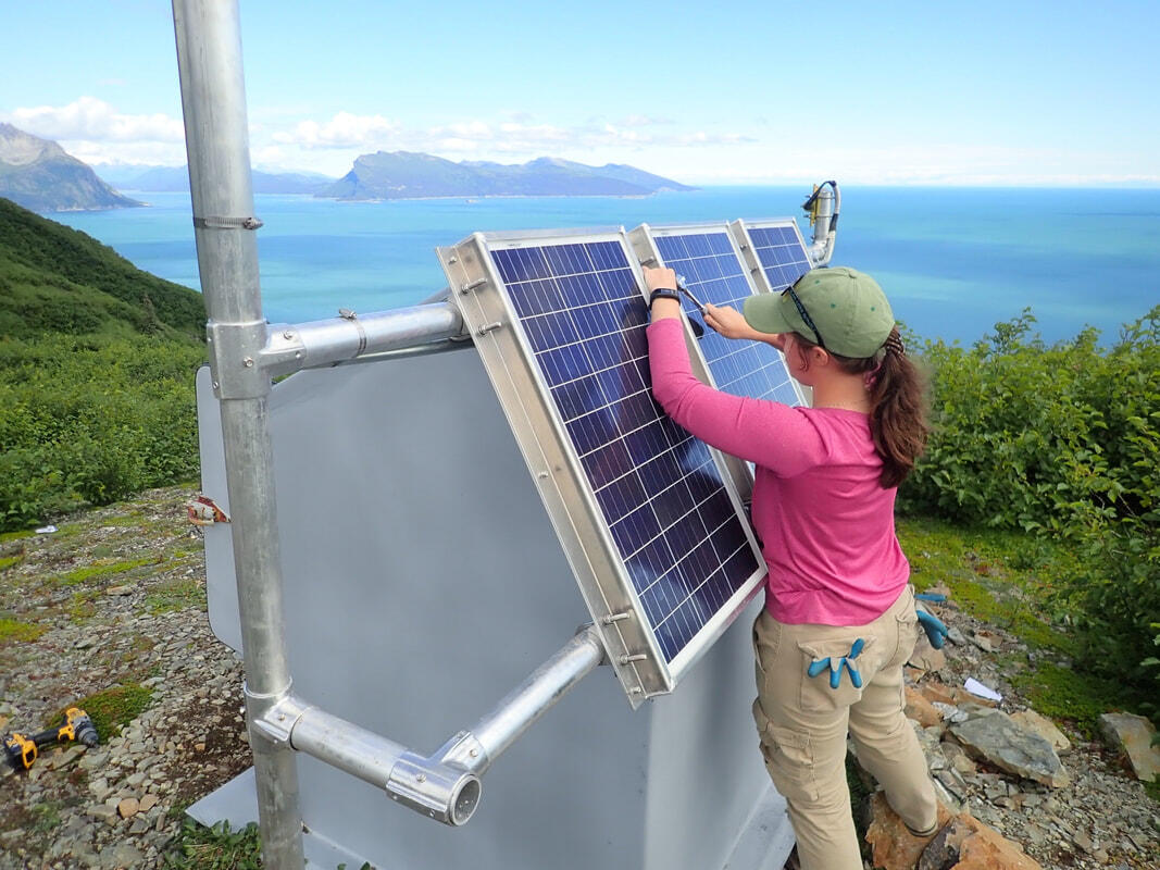 USGS scientist Alex Iezzi fixing permanent monitoring stations in Alaska. 