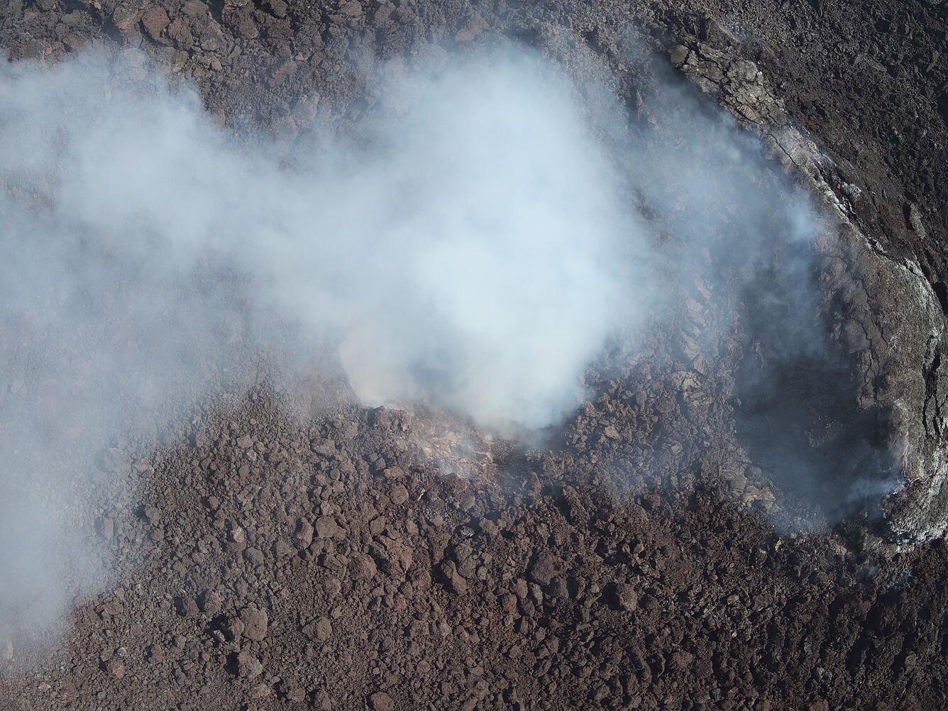 Color photograph of volcanic vent degassing