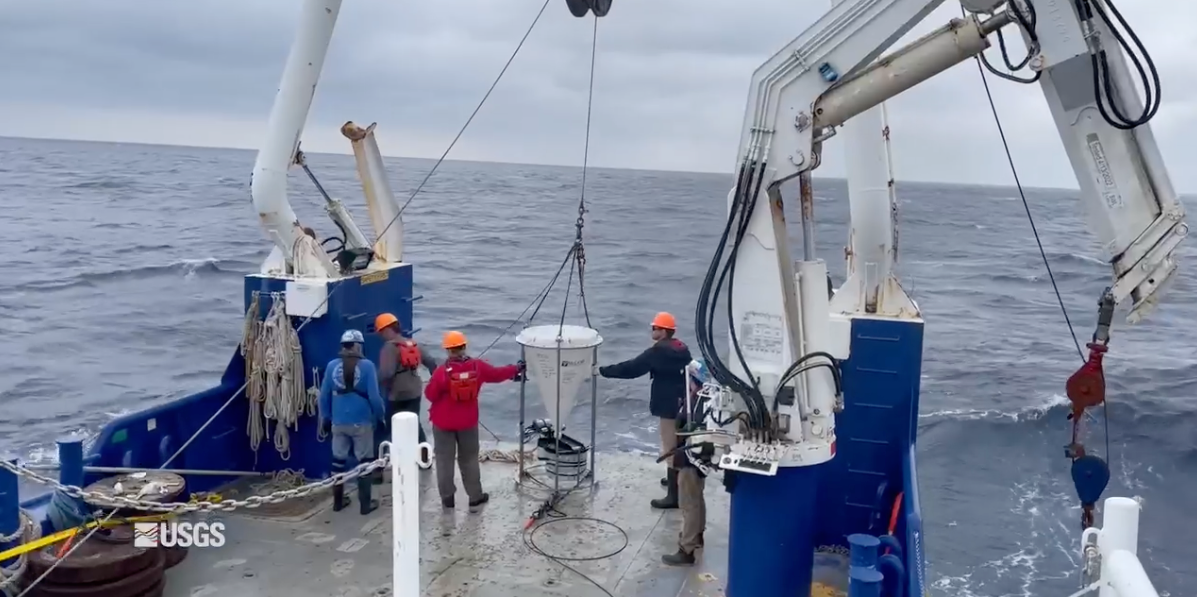 view looking towards back of ship as science crew prepare to deploy sediment trap