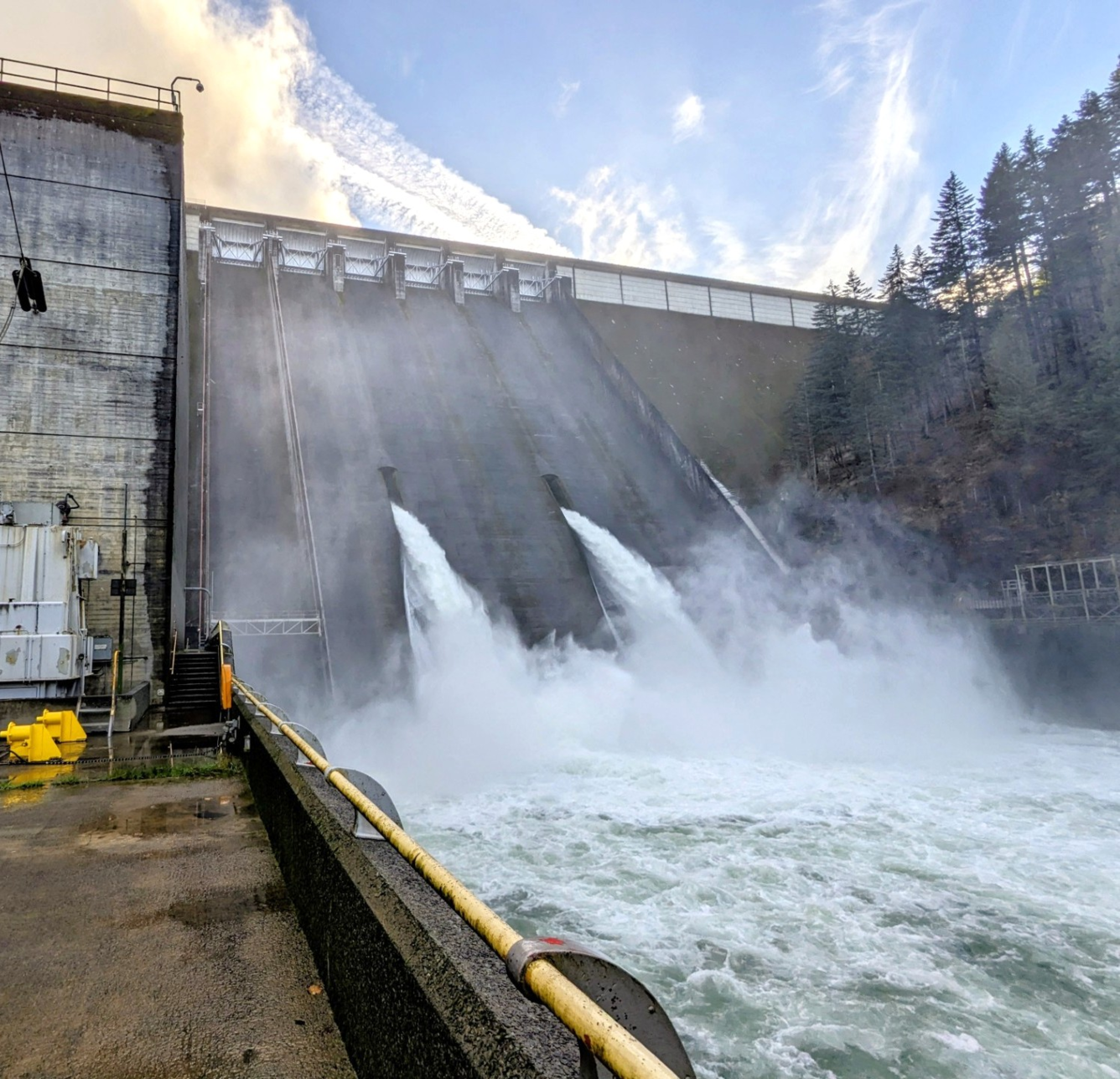 sloped concrete dam wall. 