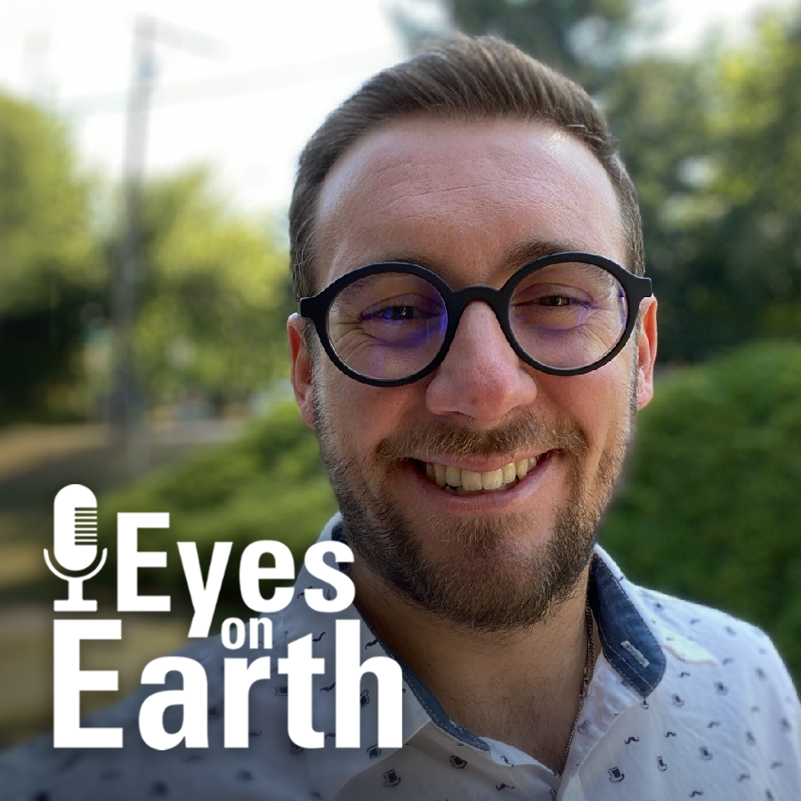 Mugshot of man wearing glasses outdoors with Eyes on Earth label in the lower left