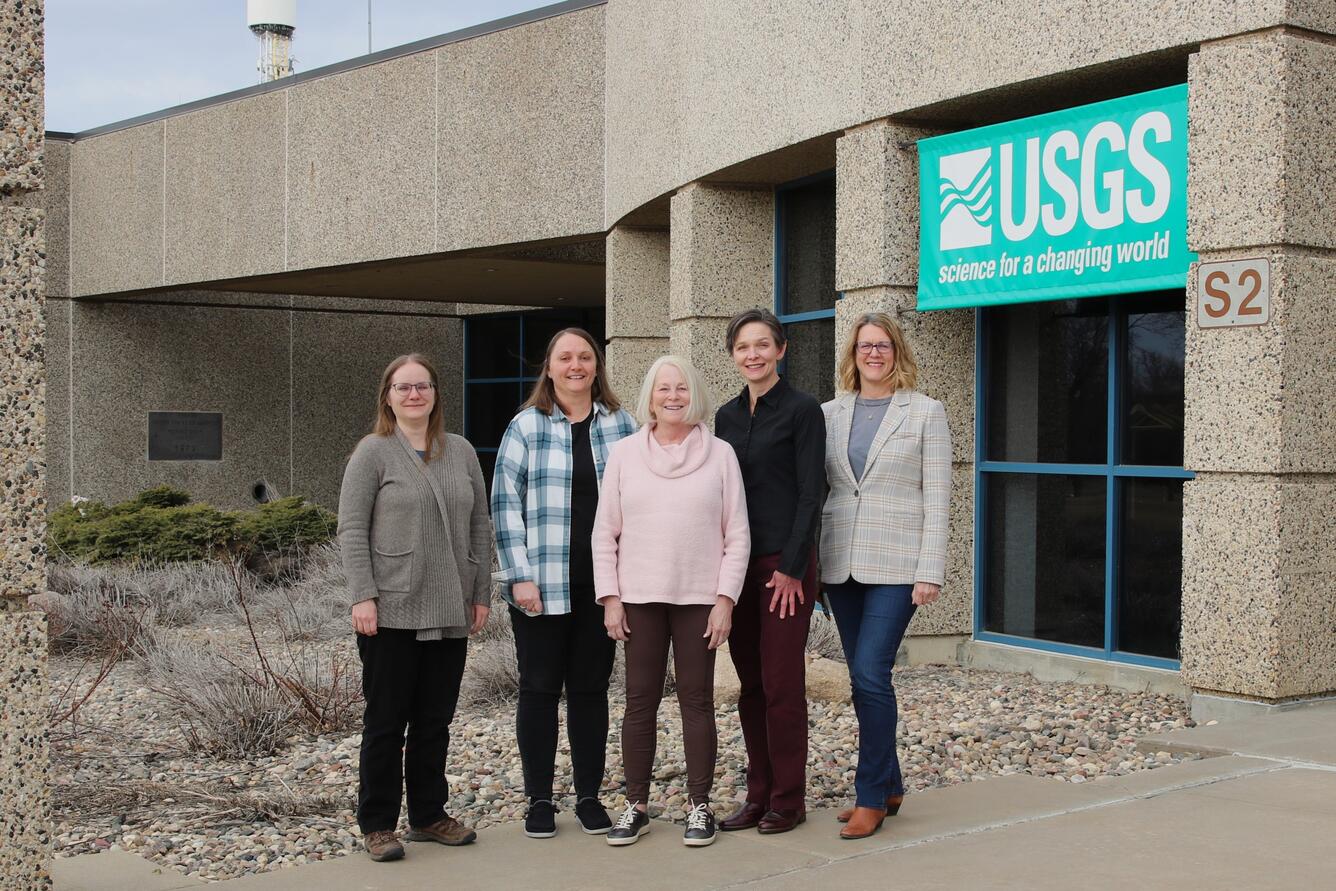 Women standing in front of a building