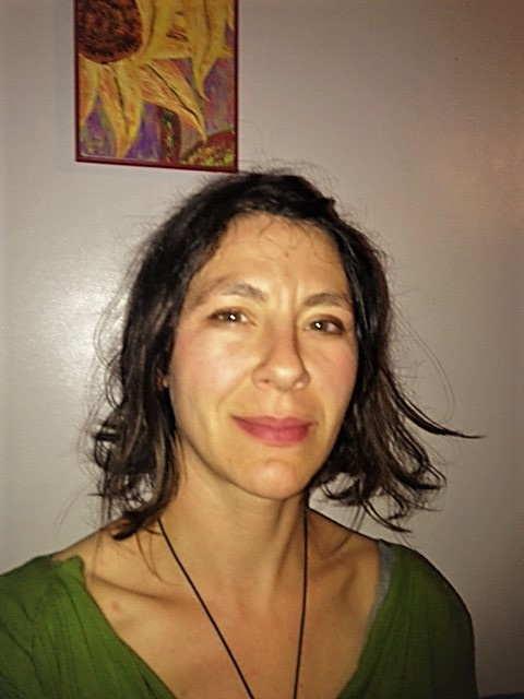 A profile picture of a woman with short, dark hair. 