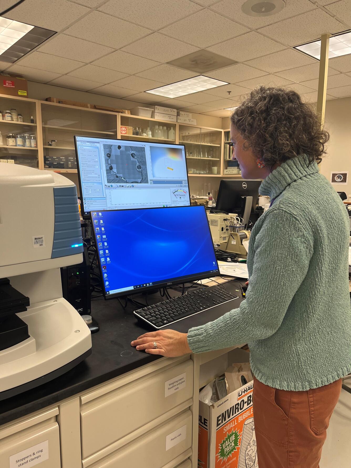 Research Scientist Emily Johnson calibrates the FTIR in the CVO Petrology Lab