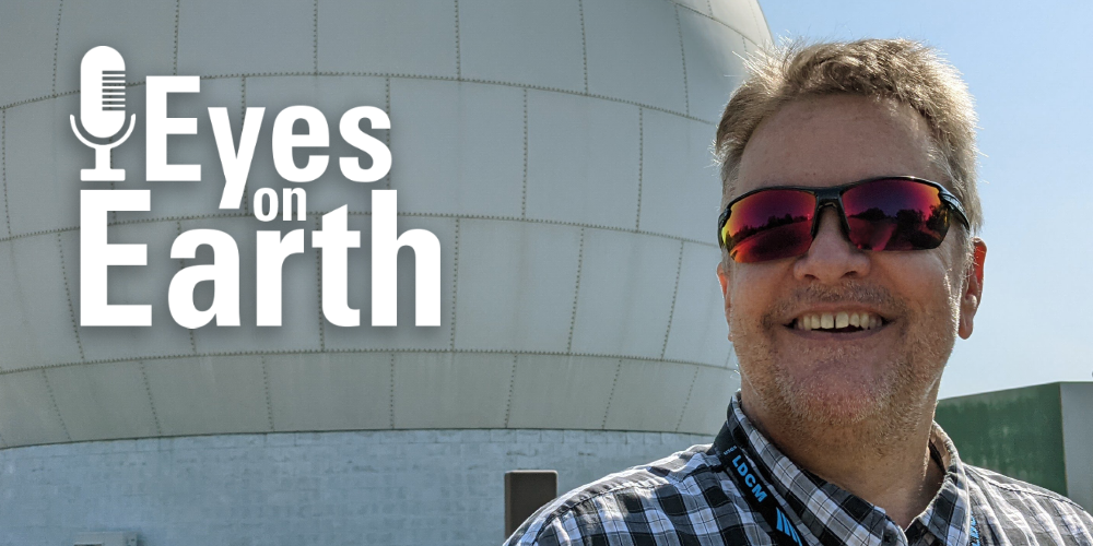 man in front of dome overlaid with logo