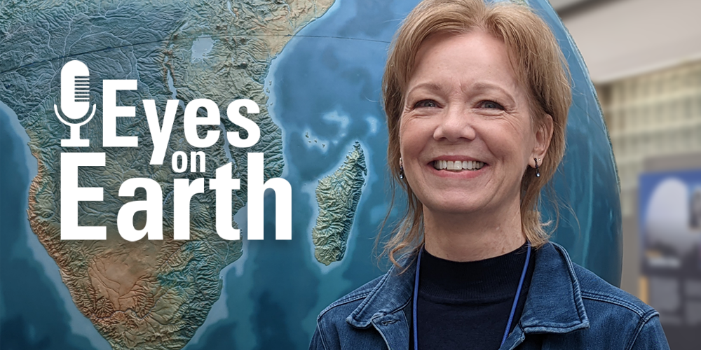 Logo with background of woman standing in front of large globe taller than her