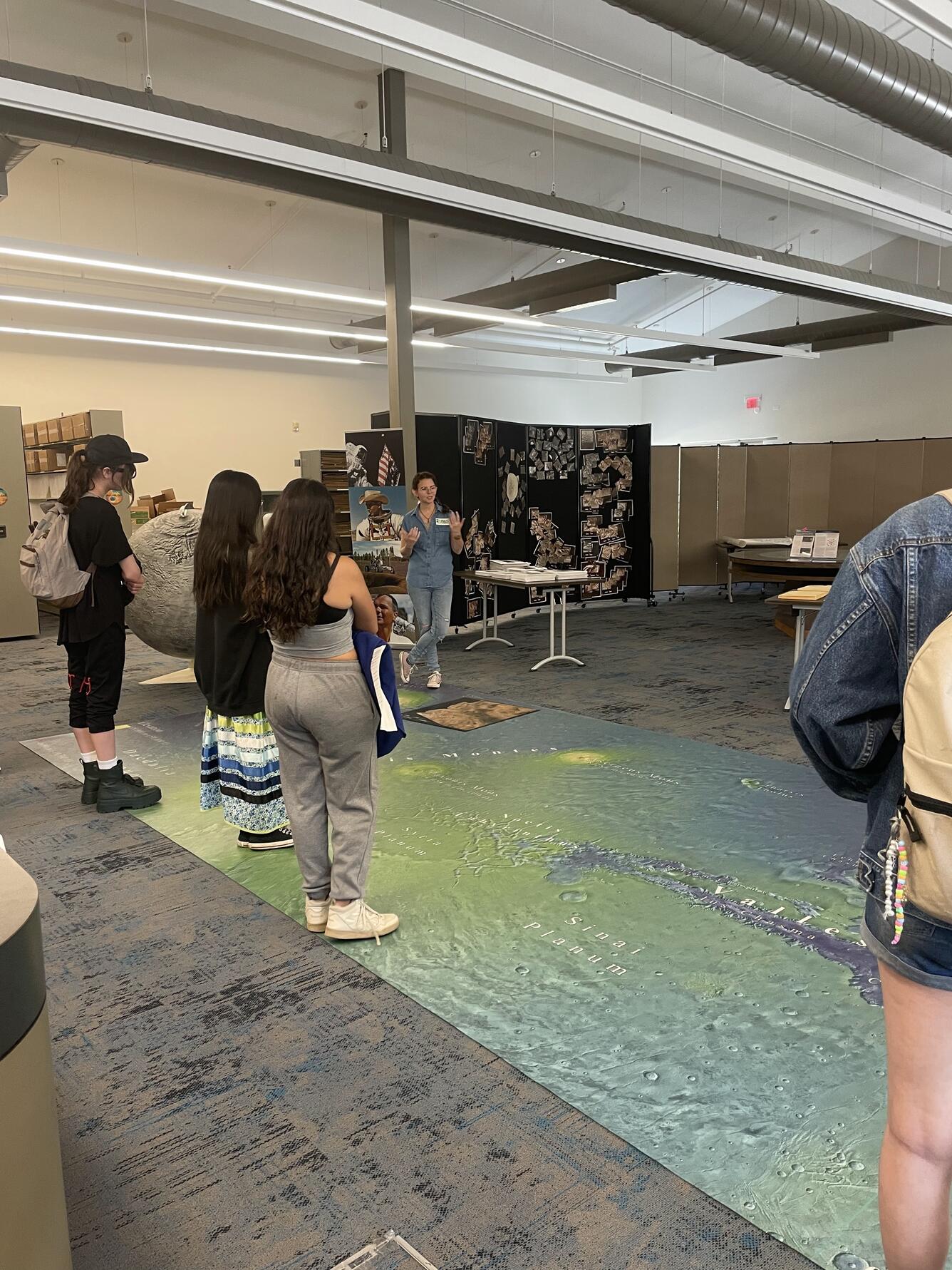 A USGS physical scientist speaks to students in the NASA Astrobiology building on the Flagstaff Science Center campus