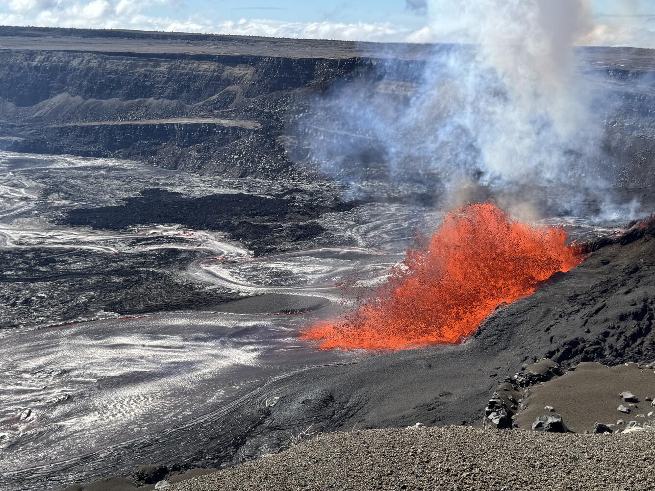 Lava fountaining from a vent in the crater wall