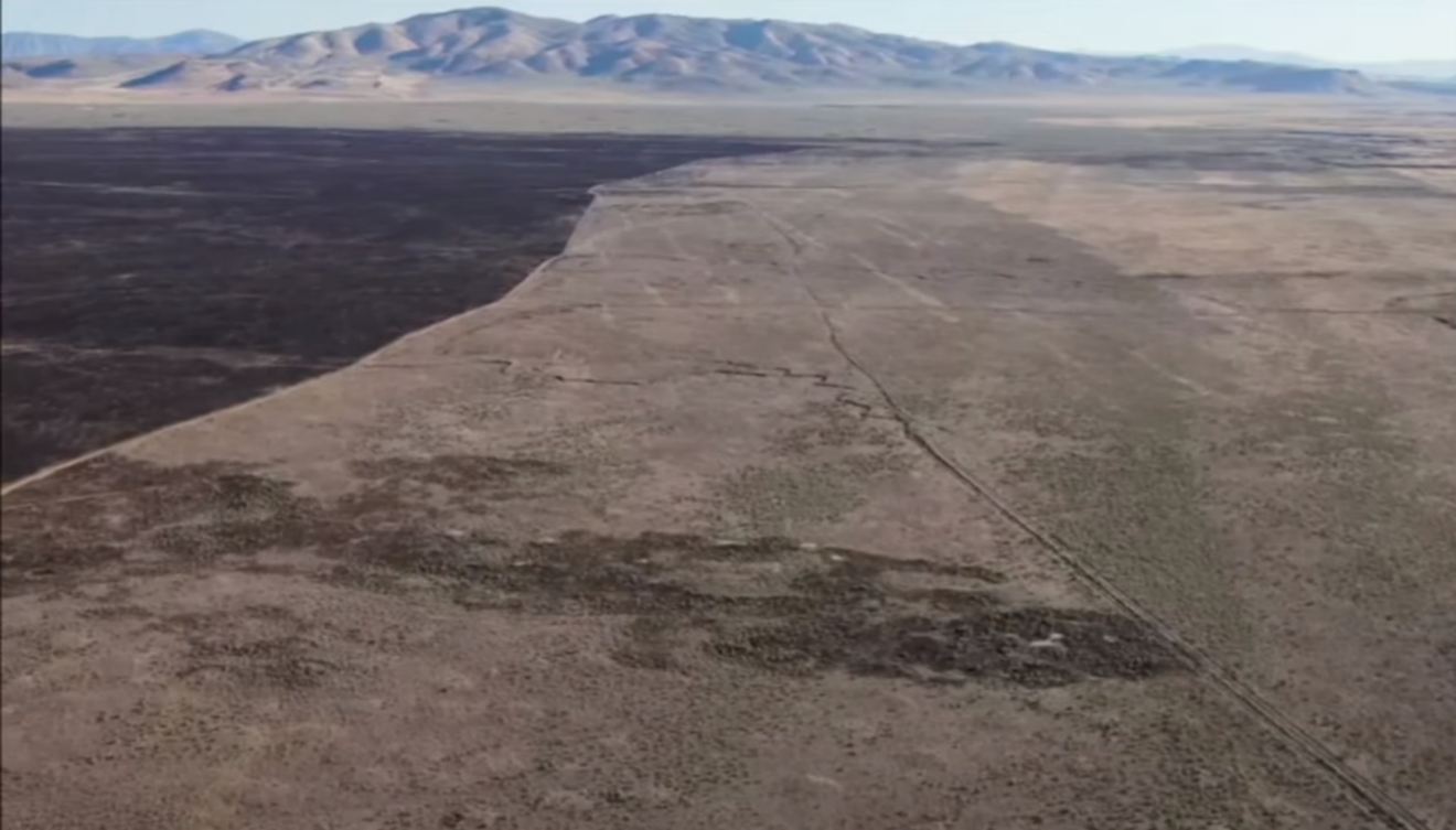 A photo depicting a fire stopped through active suppression