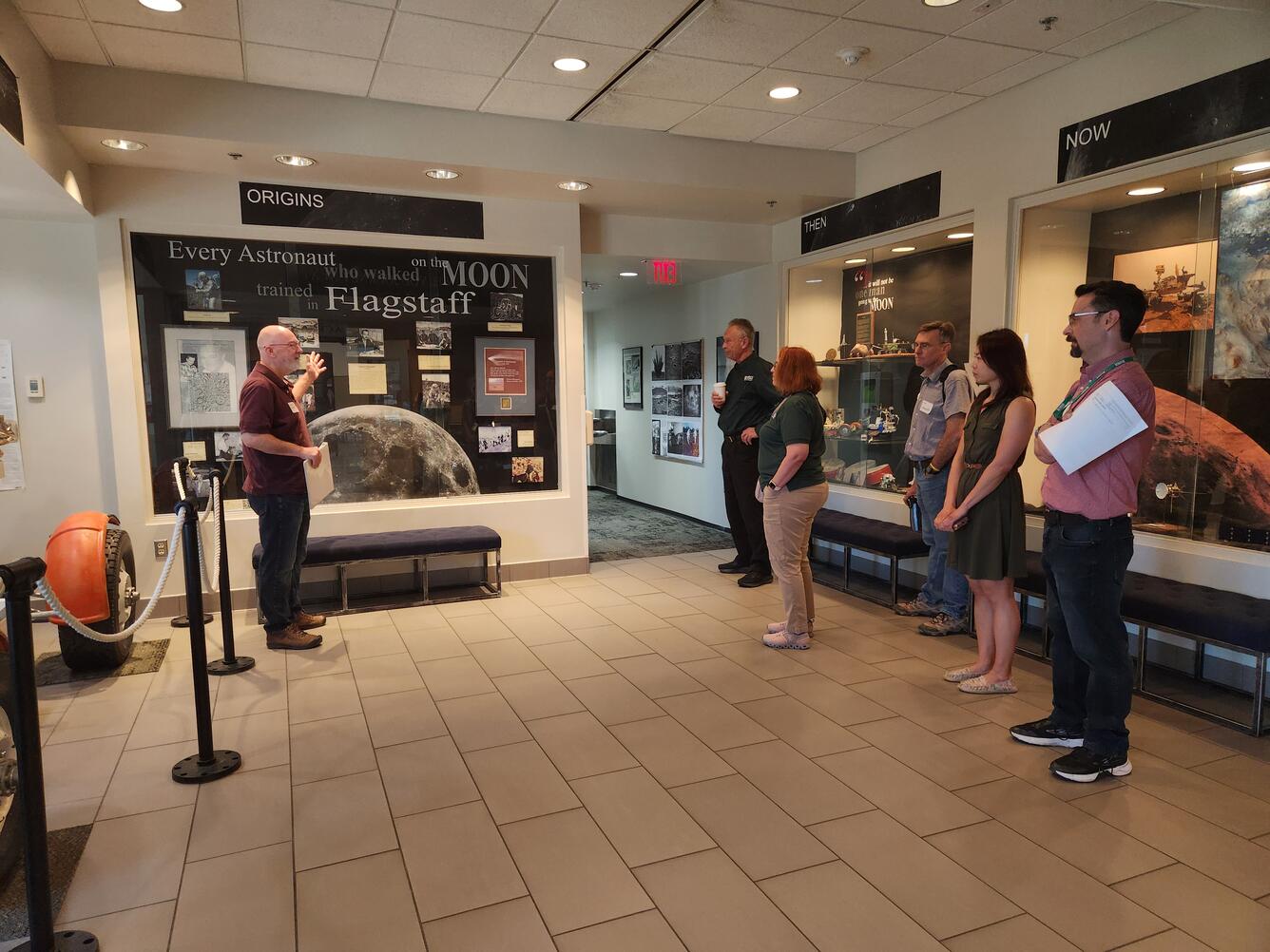 Tour Stop at Astrogeology Science Center: Discuss displays of historic artifacts on display in the lobby.