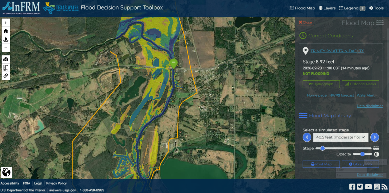 A screenshot of the flood decision support toolbox; the topographic map shows yellow and green areas.